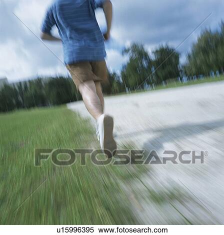 Stock Photography - Man running, rear view. Fotosearch