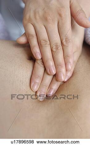 Massage therapist massaging man's back, close up View Large Photo Image Stock Photo - Massage therapist massaging man's back, close up. Fotosearch