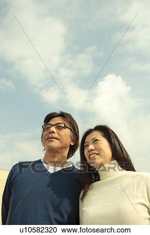 Mature couple, Low angle view View Large Photo Image Stock Image - Mature couple, Low angle view. Fotosearch