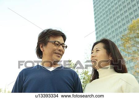 Picture - Mature couple talking. Fotosearch