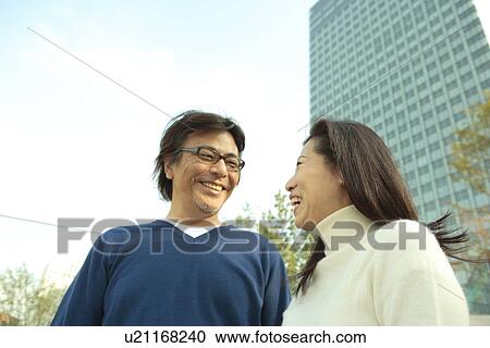Stock Image - Mature couple talking. Fotosearch