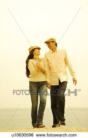 Mature couple walking on beach View Large Photo Image Stock Photo - Mature couple walking on beach. Fotosearch