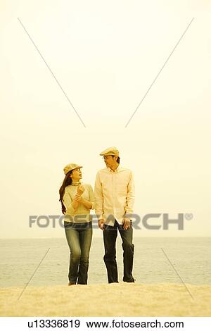 Mature couple walking on beach View Large Photo Image Stock Photo - Mature couple walking on beach. Fotosearch