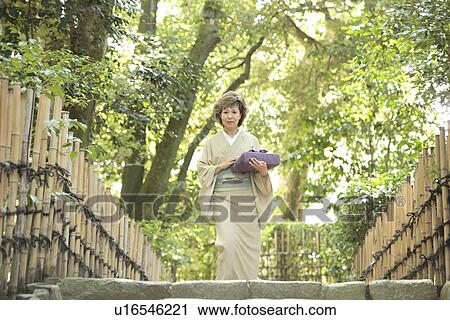 Mature woman in Kimono holding gift, Kyoto city, Kyoto prefecture, Japan View Large Photo Image Stock Image - Mature woman in Kimono holding gift, Kyoto city, Kyoto prefecture, Japan. Fotosearch