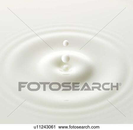 Stock Image - Milk drop, close up, full frame. Fotosearch