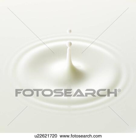 Stock Image - Milk drop, close up, full frame. Fotosearch