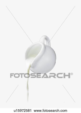 Milk pouring from pitcher View Large Photo Image Stock Image - Milk pouring from pitcher. Fotosearch
