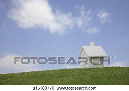 Stock Photograph - Miniature house on grass, Gunma Prefecture, Honshu, Japan. Fotosearch