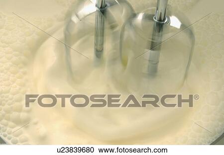 Mixer whipping cream, close up, blurred motion View Large Photo Image Stock Image - Mixer whipping cream, close up, blurred motion. Fotosearch