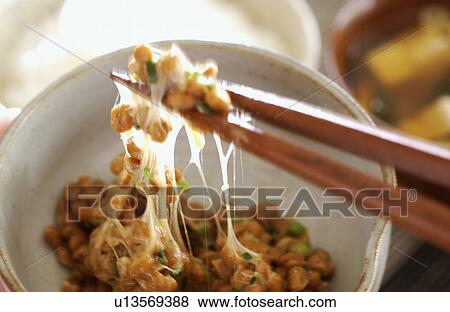 Stock Photo - Mixing natto with chopsticks. Fotosearch