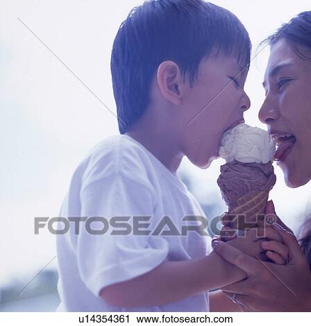 Stock Image - Mother and son eating ice cream. Fotosearch