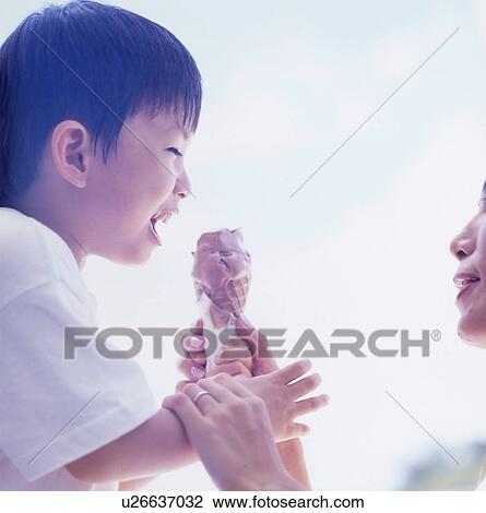 Mother and son eating ice cream View Large Photo Image Stock Image - Mother and son eating ice cream. Fotosearch