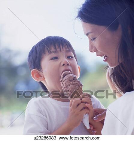 Mother and son holding ice cream View Large Photo Image Stock Image - Mother and son holding ice cream. Fotosearch