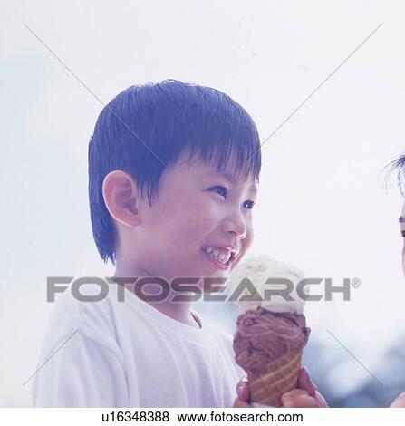 Stock Photo - Mother and son holding ice cream. Fotosearch