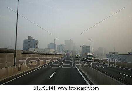 Stock Image - Office buildings and highway, Tokyo prefecture, Kanagawa prefecture, Japan. Fotosearch
