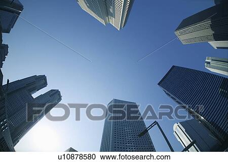 Stock Image - Office buildings under blue sky, Tokyo prefecture, Japan. Fotosearch