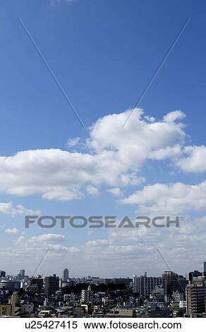 Stock Photography - Office buildings under sky, copy space, Tokyo prefecture, Japan. Fotosearch