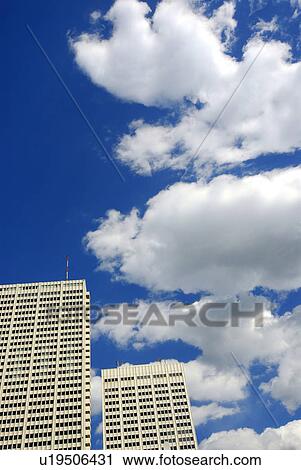 Stock Image - Office buildings under sky, Tokyo prefecture, Japan. Fotosearch