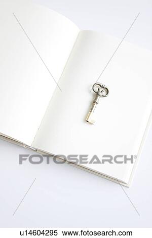 Old key on opened book, white background View Large Photo Image Stock Photography - Old key on opened book, white background. Fotosearch
