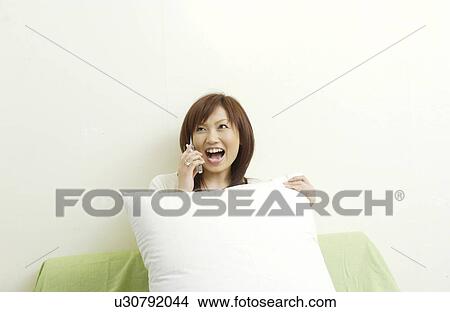 One young woman on cell phone View Large Photo Image Picture - One young woman on cell phone. Fotosearch