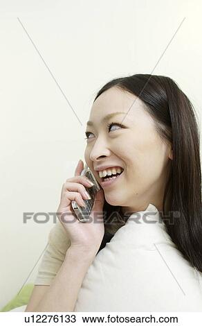 One young woman on cell phone View Large Photo Image Stock Image - One young woman on cell phone. Fotosearch