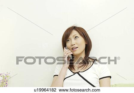 One young woman on cell phone View Large Photo Image Stock Image - One young woman on cell phone. Fotosearch