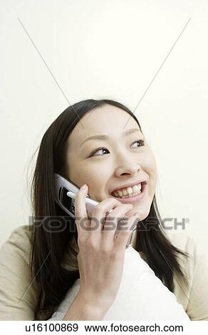 One young woman on cell phone View Large Photo Image Stock Photo - One young woman on cell phone. Fotosearch