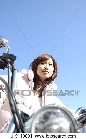 One young woman on motorcycle View Large Photo Image Stock Image - One young woman on motorcycle. Fotosearch