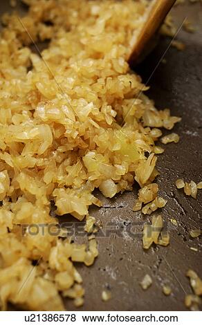 Onion being fried on pan, close up View Large Photo Image Stock Photo - Onion being fried on pan, close up. Fotosearch