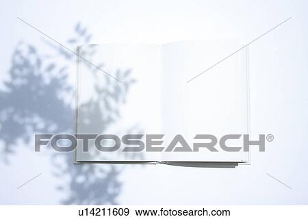 Stock Photo - Opened book, white background. Fotosearch