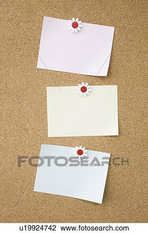 Stock Image - Papers tacked on cork board, copy space. Fotosearch