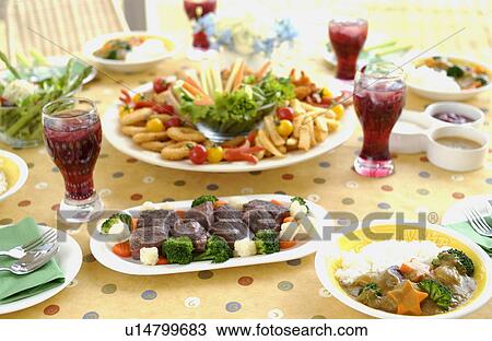 Party dishes on dining table View Large Photo Image Stock Image - Party dishes on dining table. Fotosearch