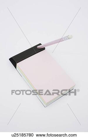 Stock Image - Pencil and note pad on white background. Fotosearch