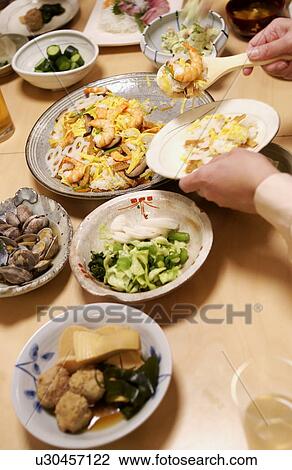 People eating Japanese food View Large Photo Image Stock Image - People eating Japanese food. Fotosearch
