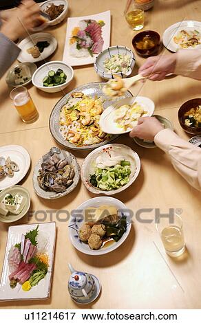 People eating Japanese food View Large Photo Image Stock Photo - People eating Japanese food. Fotosearch