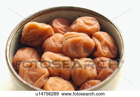 Stock Photo - Pickled plums in a bowl. Fotosearch
