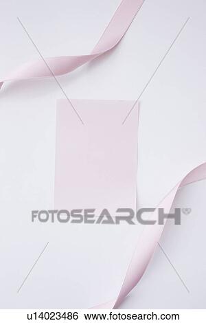 Pink ribbons and paper on white background, copy space View Large Photo Image Stock Photograph - Pink ribbons and paper on white background, copy space. Fotosearch