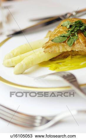Plate of asparagus and puff pastry, close up View Large Photo Image Stock Image - Plate of asparagus and puff pastry, close up. Fotosearch