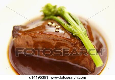 Plate of braised beef, close up, white background View Large Photo Image Stock Image - Plate of braised beef, close up, white background. Fotosearch