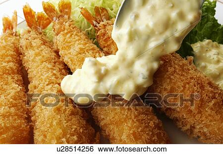 Stock Photograph - Plate of deep fried prawns, close up. Fotosearch