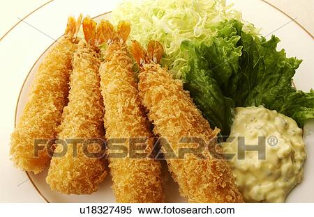 Stock Photography - Plate of deep fried prawns, close up, white background. Fotosearch