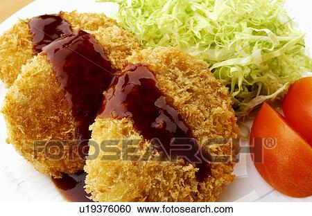 Stock Image - Plate of fried croquettes, close up. Fotosearch