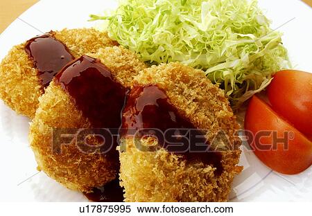 Stock Photography - Plate of fried croquettes, close up. Fotosearch