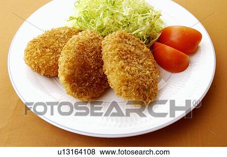 Plate of fried croquettes, colored background View Large Photo Image Stock Photo - Plate of fried croquettes, colored background. Fotosearch
