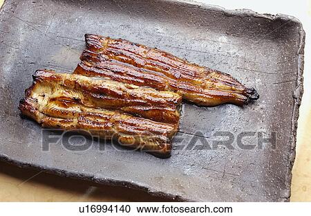 Stock Image - Plate of grilled eel. Fotosearch