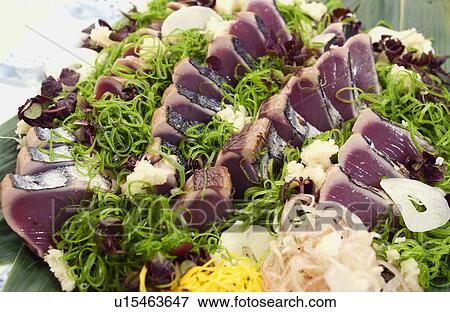 Stock Photo - Plate of sliced bonito, close up. Fotosearch