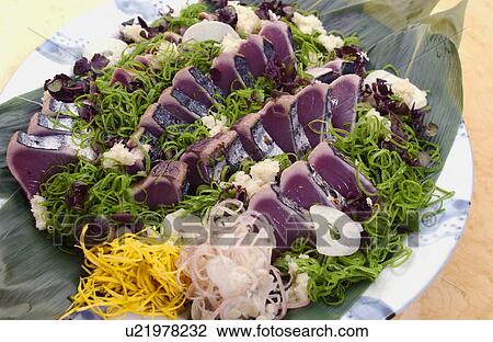 Stock Image - Plate of sliced bonito. Fotosearch