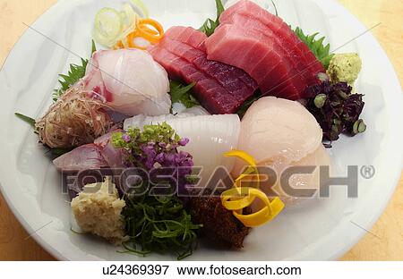 Plate of sliced fish, close up View Large Photo Image Stock Photo - Plate of sliced fish, close up. Fotosearch