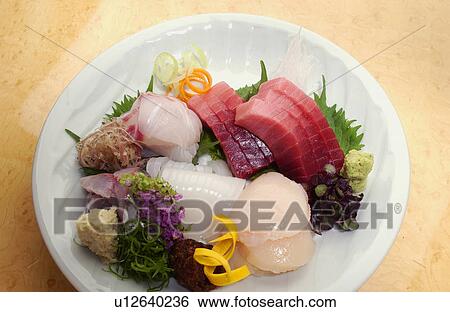 Stock Photograph - Plate of sliced fish. Fotosearch