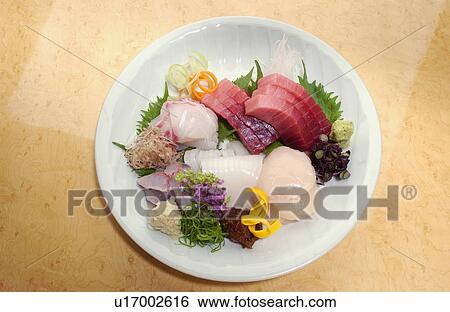 Stock Photograph - Plate of sliced fish. Fotosearch